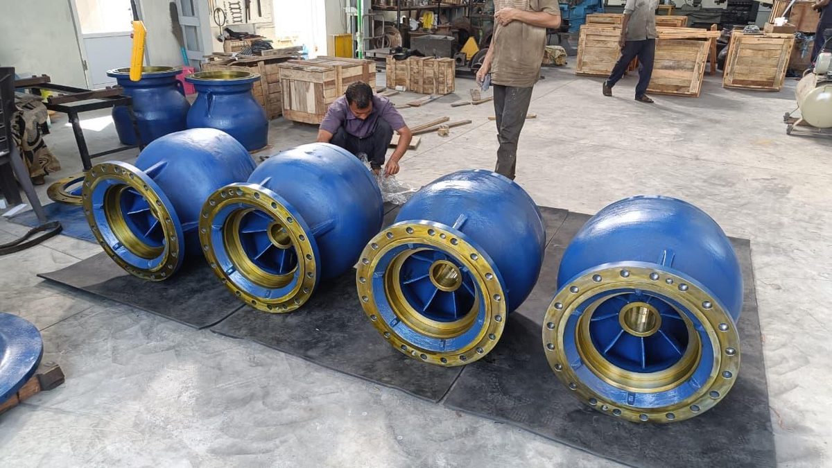 Team assembling blue and gold pump bowls