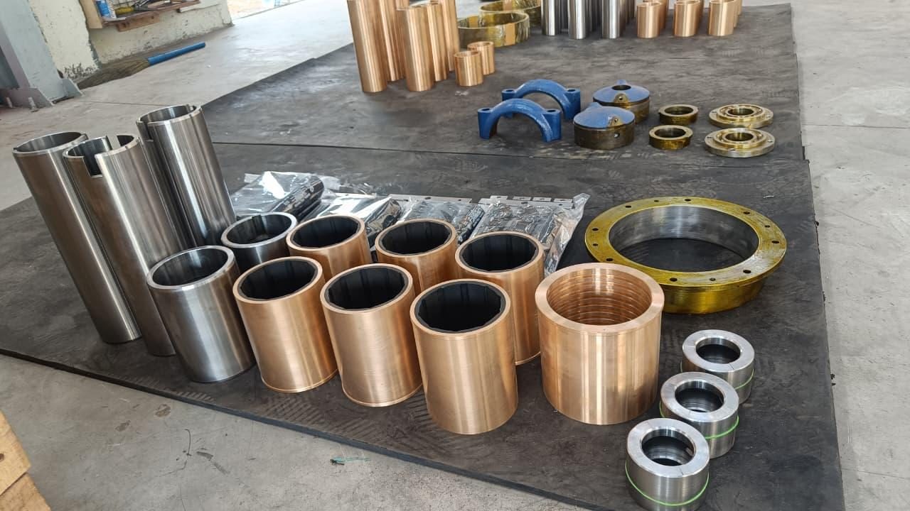 Mixed batch of bronze and steel pump sleeves and flanges