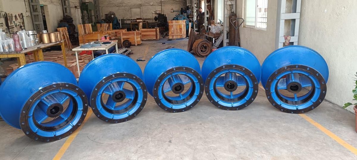 Batch of blue pump bowl housings with black flanges