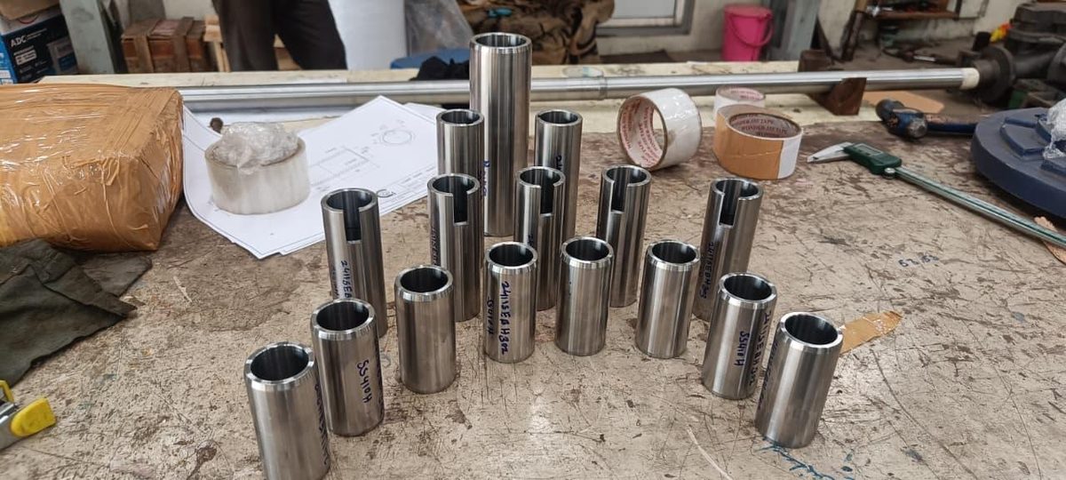 Steel sleeves array on workbench