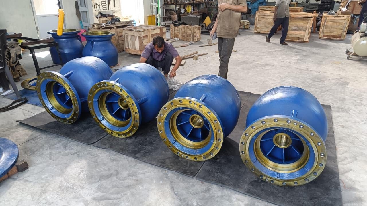 Team assembling blue and gold pump bowls